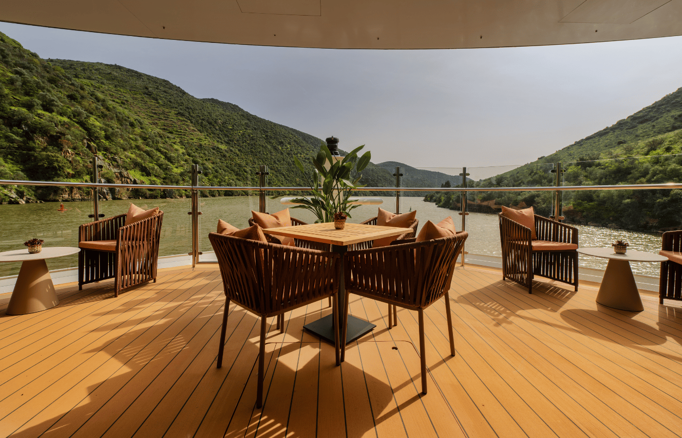 Panoramic river cruise observation lounge overlooking the passing landscape