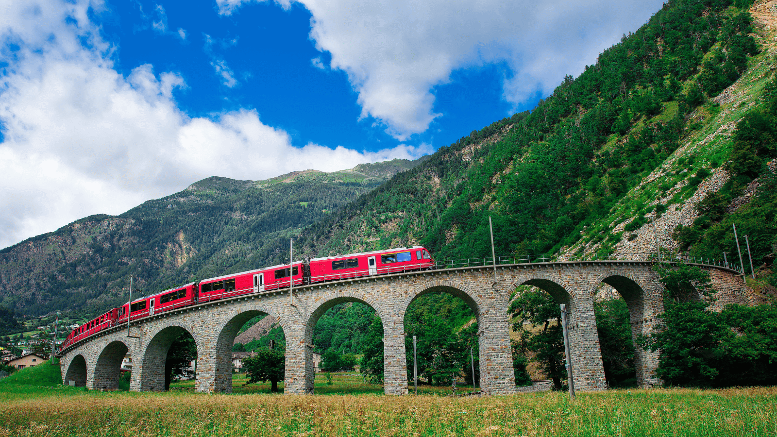 Bernina Express scenic train traveling through the Swiss Alps