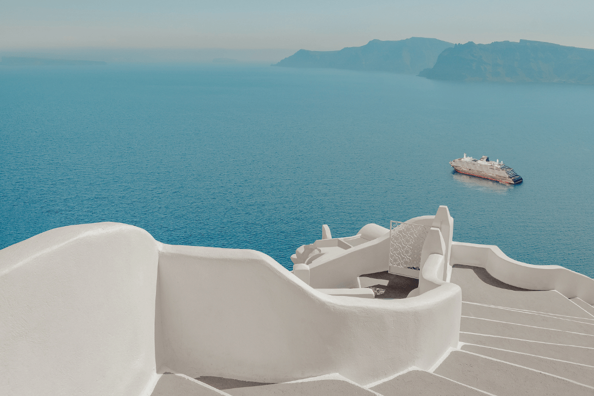 Small luxury ocean ship sailing near the Greek islands