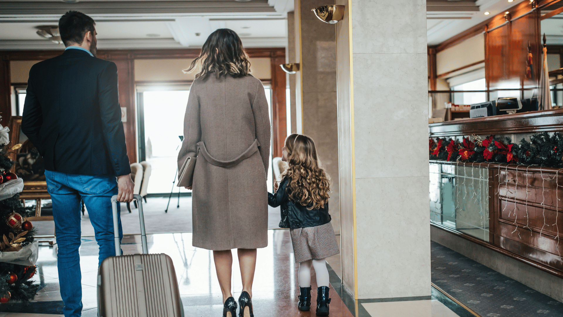 Family arriving confidently at their hotel after an international journey